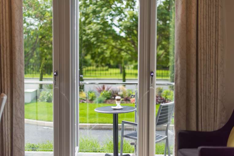 Park Hotel Accommodation (102) Outdoor Seating Area with Coffee on Table