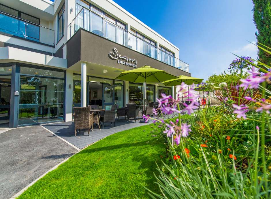 Park Hotel Seasons Bar and Brasserie External View with Outdoor Seating and Flowers